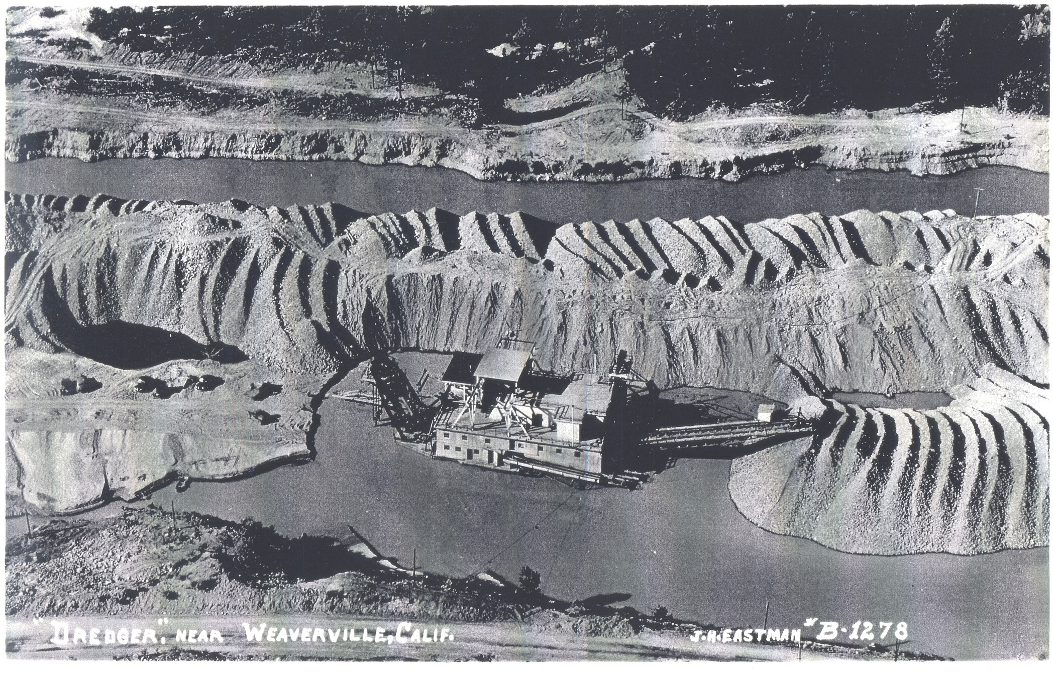 A gold dredger on Trinity River near Lewiston, CA in 1950.